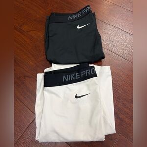 TWO pairs of Nike Pro Spandex 7” Size M B&W; black is NWT and white is like new